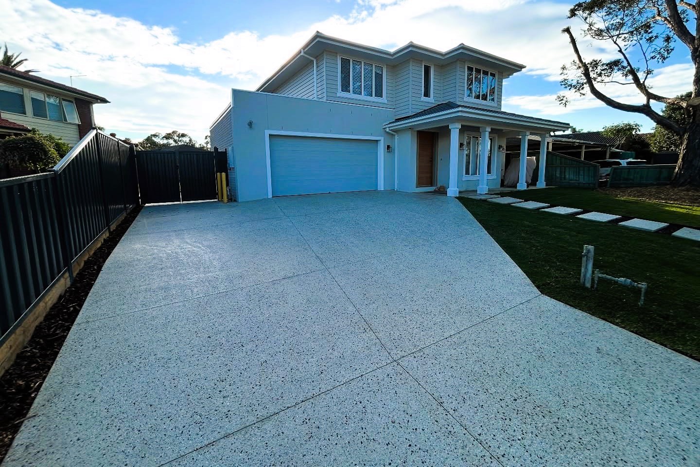 home with a decorative concrete design driveway