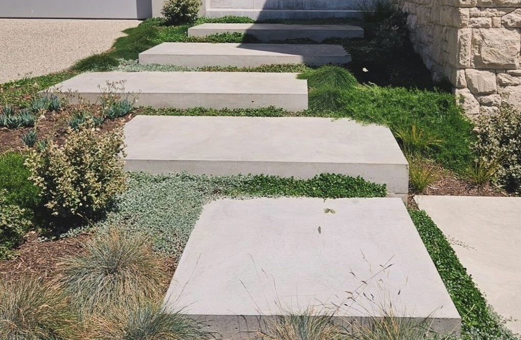 Front walkway is made with concrete pavers.