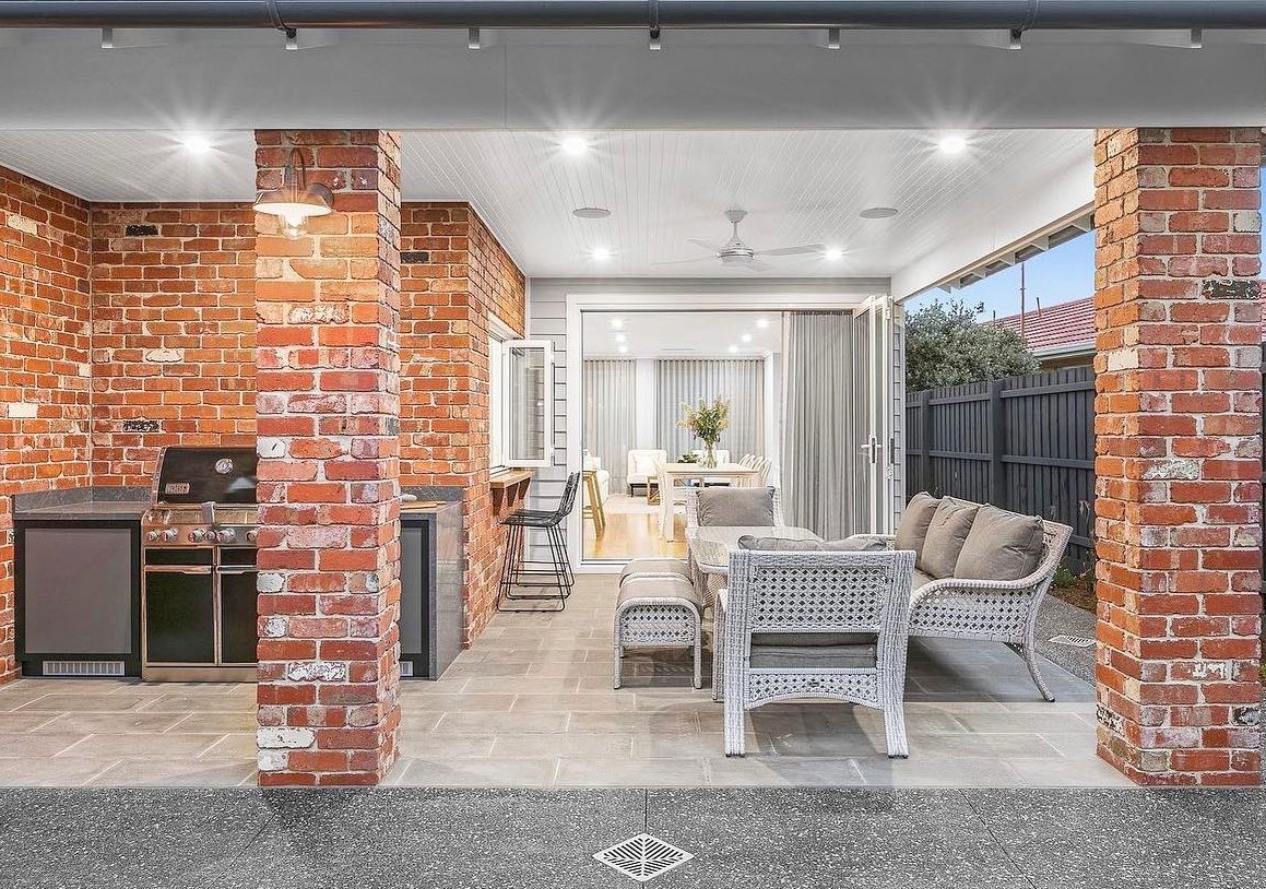 outdoor concrete patio with decorative elements.